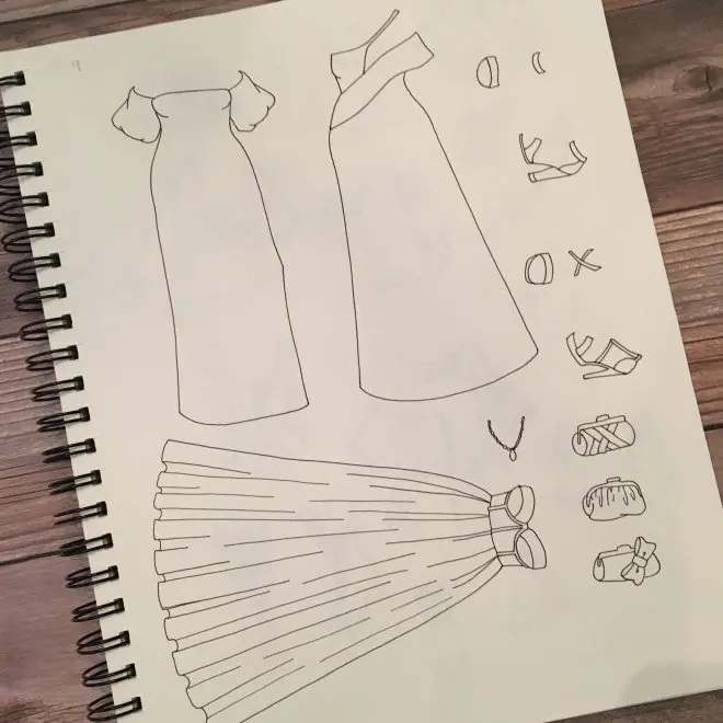 A page of my sketchbook featuring evening gowns.